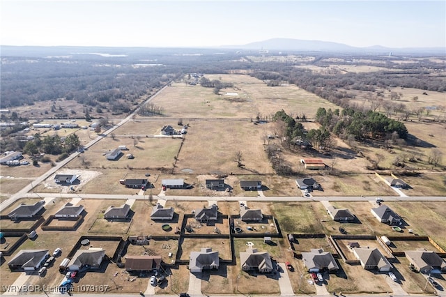 birds eye view of property featuring a mountain view