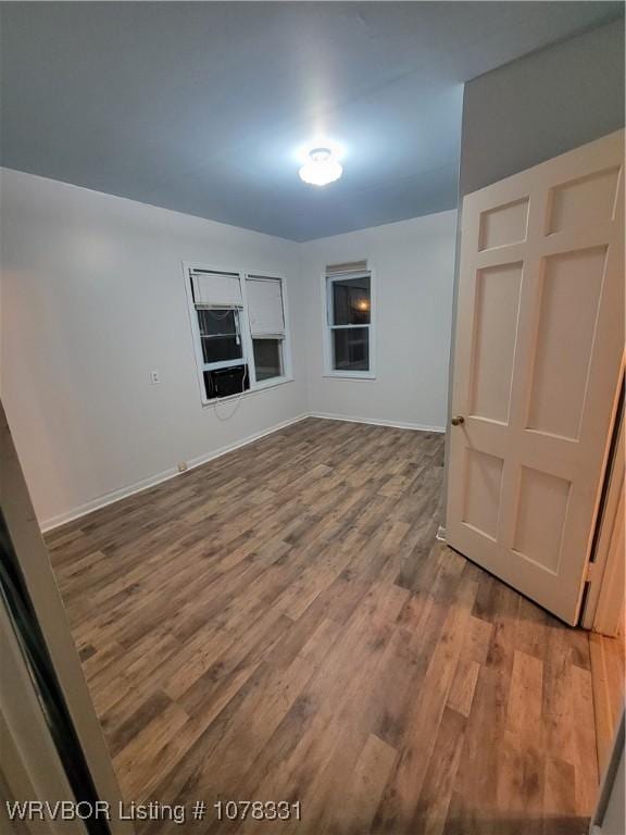 spare room featuring hardwood / wood-style flooring