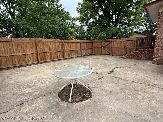 1304 S Elm St, Paris, AR 72855 - fenced backyard featuring a patio