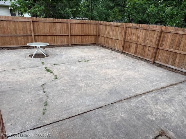1304 S Elm St, Paris, AR 72855 - fenced backyard featuring a patio