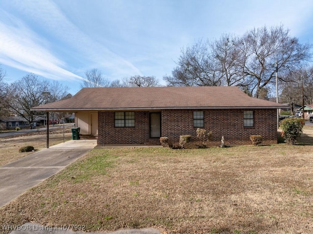 ranch-style home featuring a front yard and a carport