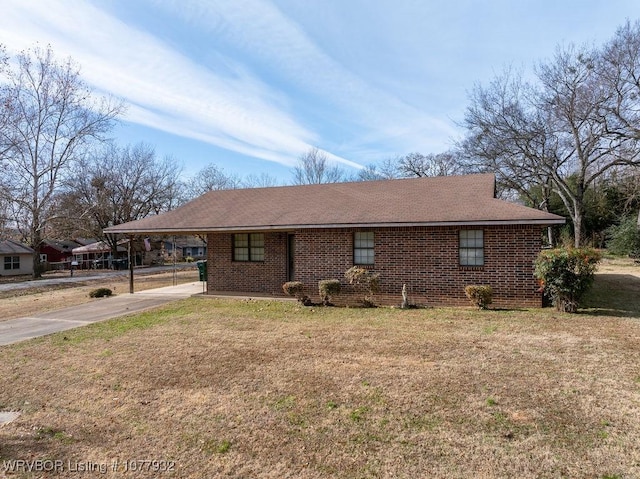 single story home featuring a front lawn and a carport