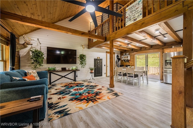16175 Cove, Prairie Grove, AR 72753 - living room with wood walls, wood finished floors, ceiling fan, and a wooden ceiling with exposed beams
