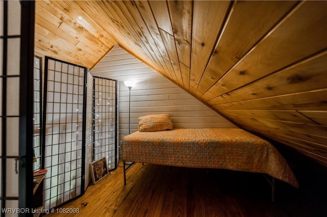 16175 Cove, Prairie Grove, AR 72753 - bedroom featuring lofted ceiling, wood ceiling, wood walls, and hardwood / wood-style flooring
