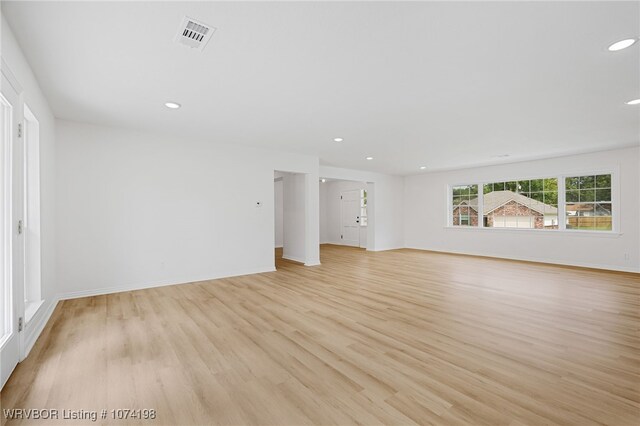 unfurnished living room with light hardwood / wood-style floors