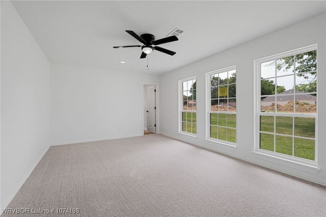 unfurnished room with carpet floors and ceiling fan