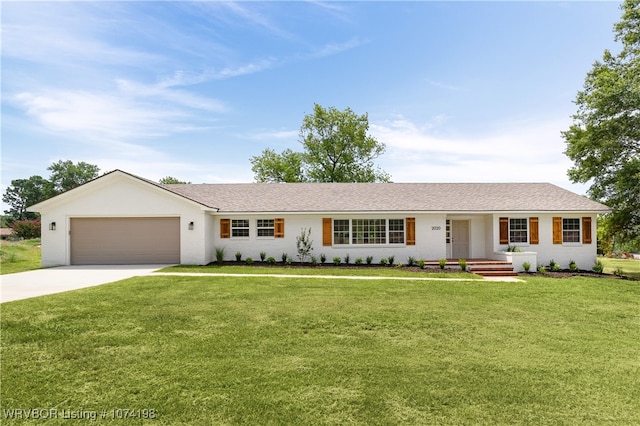 single story home featuring a front lawn and a garage