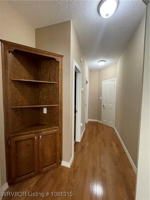 1801 Fianna Way, Fort Smith, AR 72908 - hall with wood finished floors, a textured ceiling, and baseboards