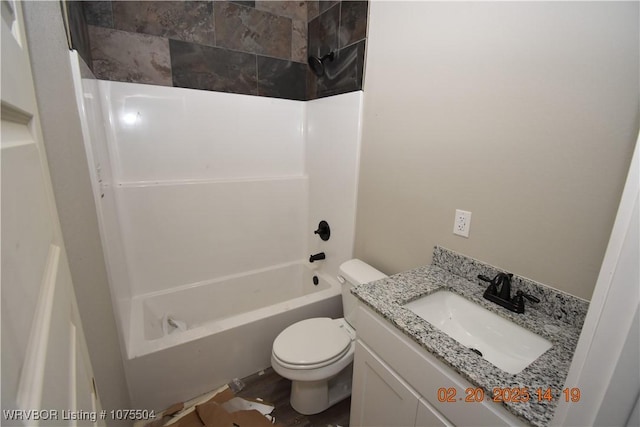 bathroom featuring toilet, shower / bath combination, and vanity