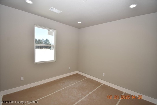 spare room with baseboards, visible vents, and recessed lighting