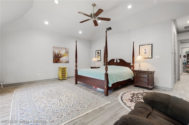 bedroom with recessed lighting, visible vents, wood finished floors, and vaulted ceiling