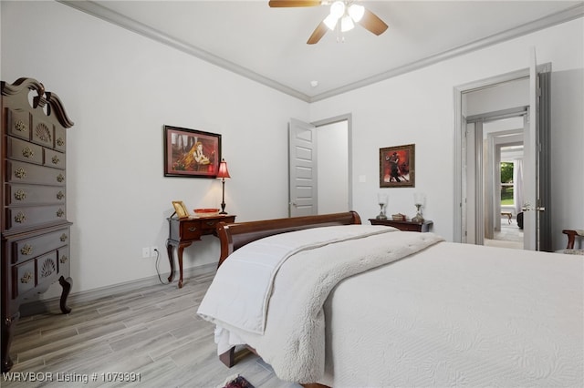 bedroom featuring a ceiling fan, light wood-style flooring, and crown molding