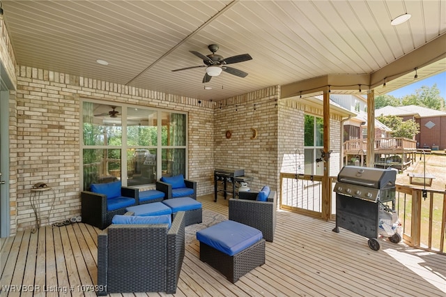 wooden terrace with a grill, a ceiling fan, and an outdoor hangout area