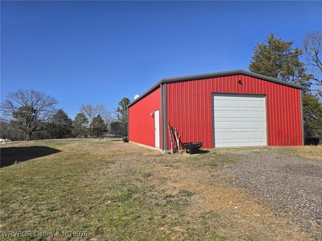 view of outbuilding with an outbuilding and driveway