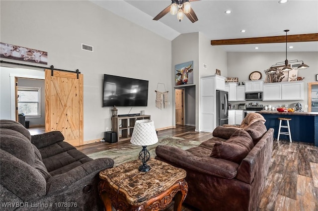 living room with visible vents, a barn door, beam ceiling, high vaulted ceiling, and dark wood-style flooring