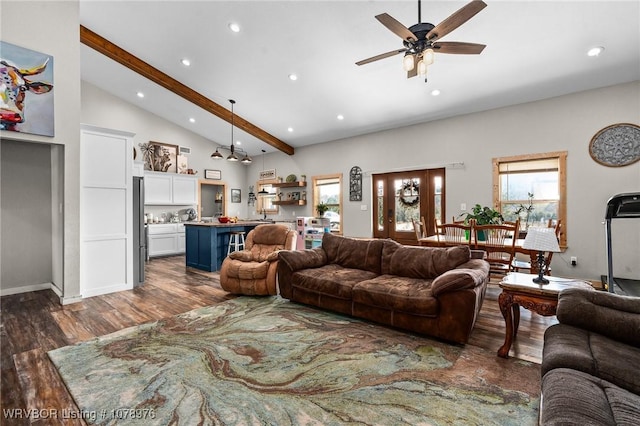 living room featuring dark wood-type flooring, ceiling fan, beam ceiling, recessed lighting, and high vaulted ceiling