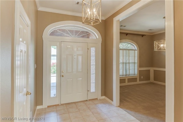 2112 Rannoch Trce, Fort Smith, AR 72908 - entryway featuring a chandelier, ornamental molding, and light carpet