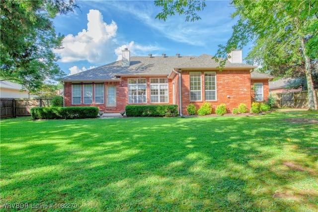 2112 Rannoch Trce, Fort Smith, AR 72908 - rear view of property featuring a chimney and brick siding