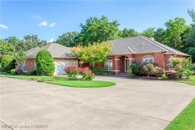2112 Rannoch Trce, Fort Smith, AR 72908 - view of front of house featuring concrete driveway, a garage, brick siding, and roof with shingles