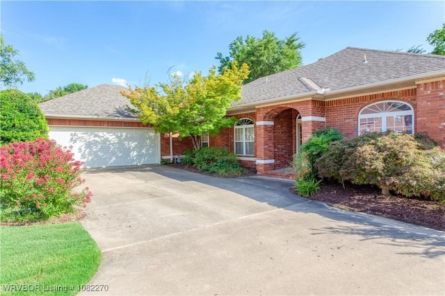 2112 Rannoch Trce, Fort Smith, AR 72908 - ranch-style home with concrete driveway, roof with shingles, brick siding, and an attached garage