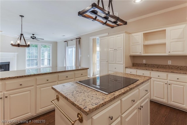 2112 Rannoch Trce, Fort Smith, AR 72908 - kitchen with black electric stovetop, a chandelier, crown molding, a kitchen island, and dark wood finished floors