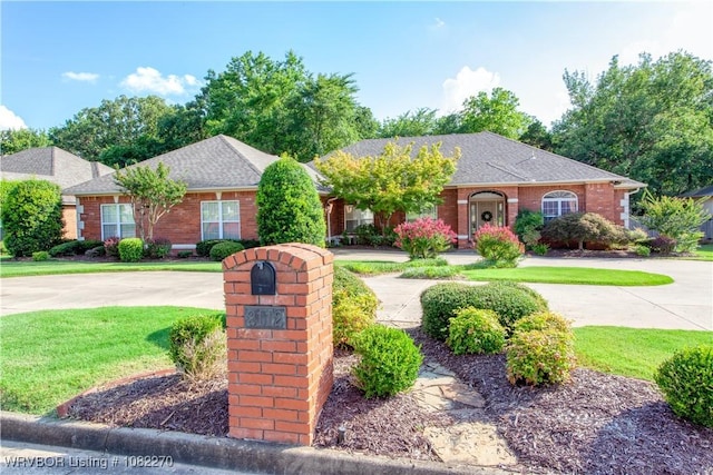 2112 Rannoch Trce, Fort Smith, AR 72908 - view of front of house featuring a front yard, brick siding, and a shingled roof