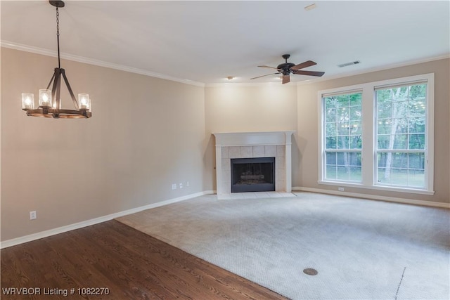 2112 Rannoch Trce, Fort Smith, AR 72908 - unfurnished living room with plenty of natural light, a ceiling fan, wood finished floors, ornamental molding, and a chandelier