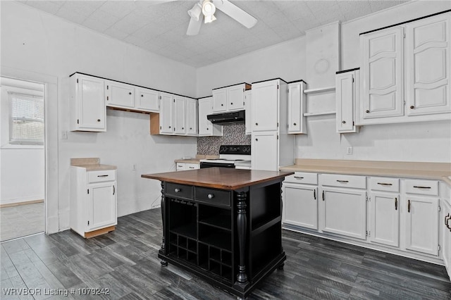 kitchen featuring under cabinet range hood, dark wood-type flooring, white cabinetry, electric range oven, and open shelves