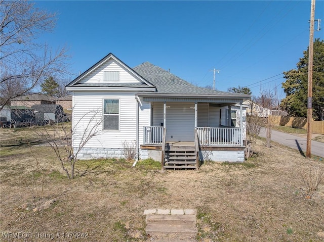 bungalow featuring a shingled roof and covered porch