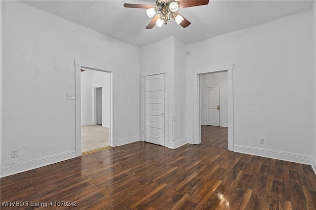 unfurnished bedroom featuring ceiling fan, baseboards, and wood finished floors