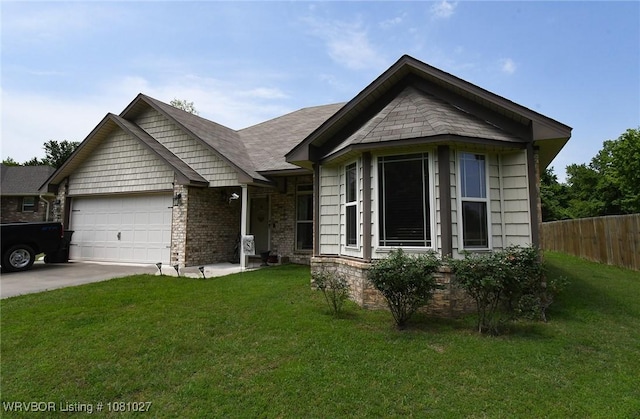 114 Stone Dr, Roland, OK 74954 - view of front of house featuring an attached garage and driveway