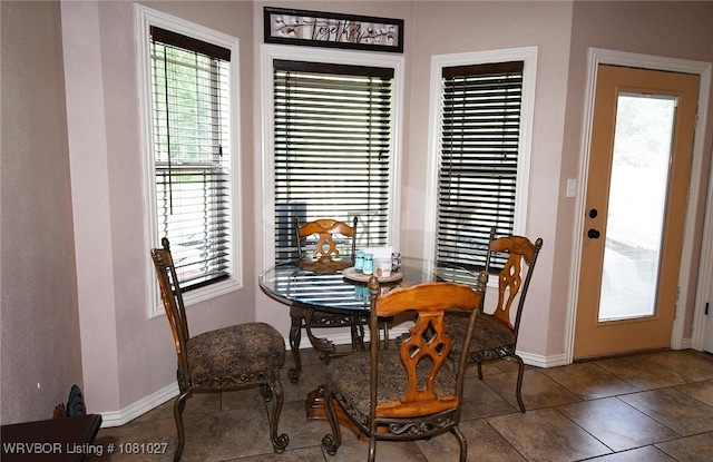 114 Stone Dr, Roland, OK 74954 - tiled dining room featuring plenty of natural light and baseboards