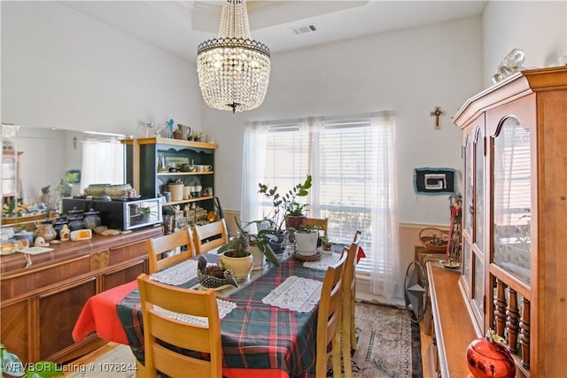 dining space with a chandelier