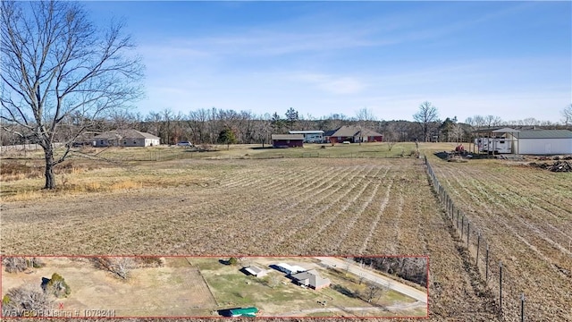 view of yard with a rural view