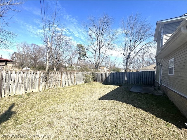 view of yard with a fenced backyard