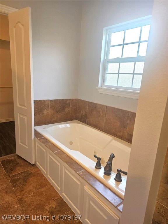 full bath with a jetted tub