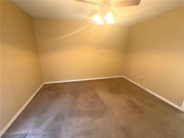 carpeted spare room featuring baseboards and ceiling fan