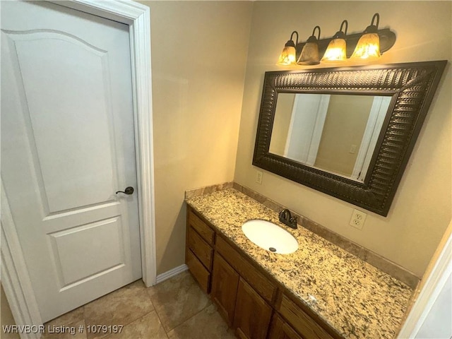 bathroom with baseboards and vanity