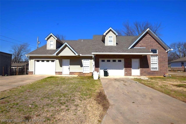 view of front of home with concrete driveway, brick siding, a shingled roof, and a front lawn