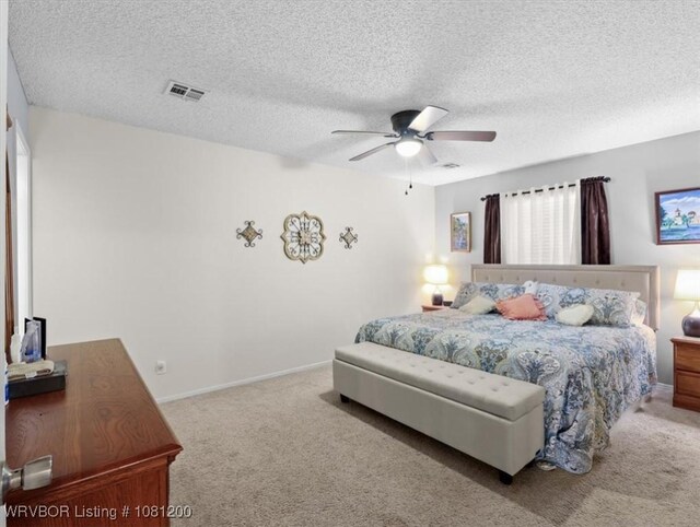 42735 Timber Ridge Rd, Howe, OK 74940 - carpeted bedroom featuring ceiling fan, baseboards, and a textured ceiling