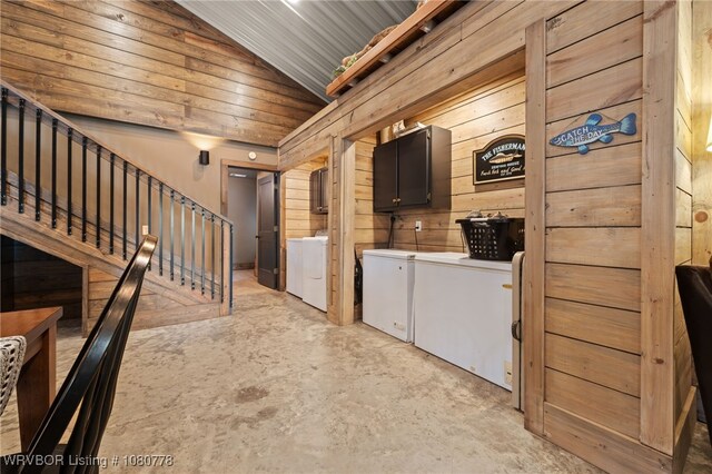 465 Boyd Dr, New Blaine, AR 72851 - kitchen with separate washer and dryer, unfinished concrete floors, wooden walls, and vaulted ceiling