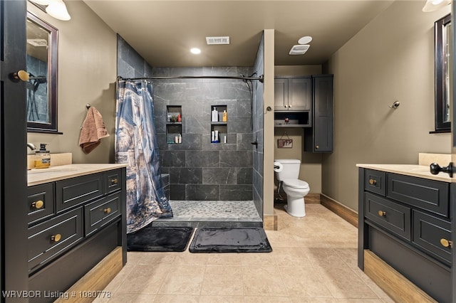 465 Boyd Dr, New Blaine, AR 72851 - full bath with toilet, a tile shower, vanity, tile patterned flooring, and baseboards