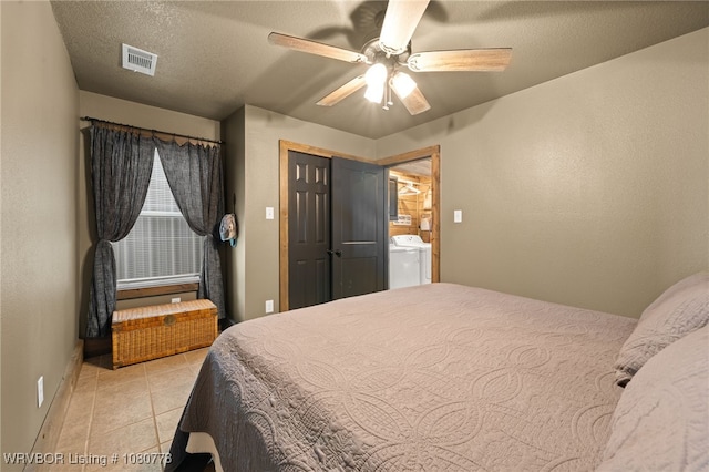 465 Boyd Dr, New Blaine, AR 72851 - bedroom with separate washer and dryer, baseboards, light tile patterned flooring, and a ceiling fan