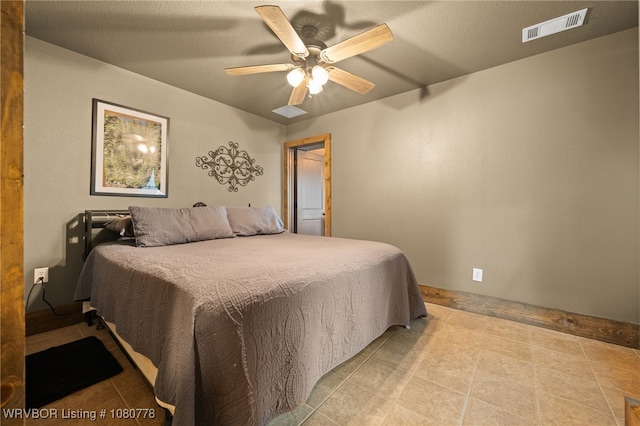 465 Boyd Dr, New Blaine, AR 72851 - tiled bedroom with ceiling fan