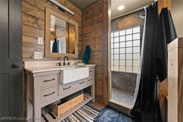 465 Boyd Dr, New Blaine, AR 72851 - full bath featuring a tile shower, wood walls, and vanity