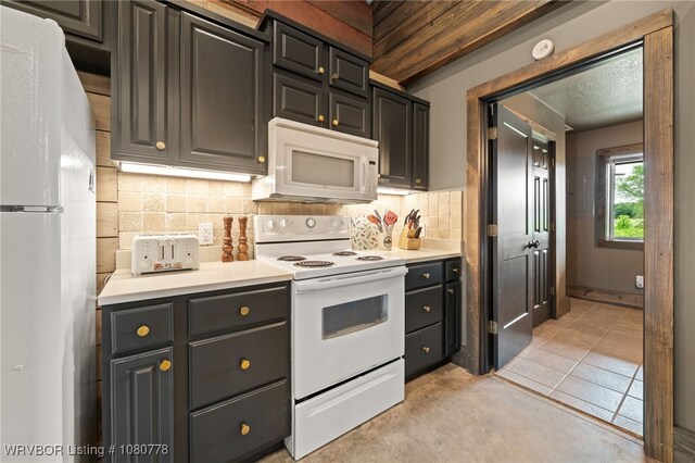 465 Boyd Dr, New Blaine, AR 72851 - kitchen featuring white appliances, tasteful backsplash, and light countertops