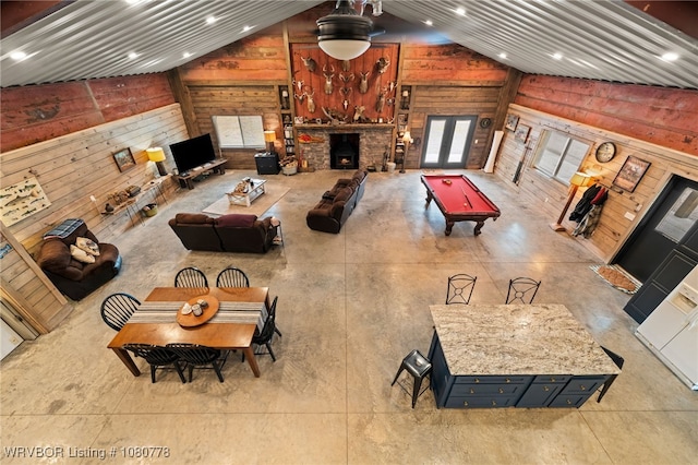 465 Boyd Dr, New Blaine, AR 72851 - living area with vaulted ceiling, wood walls, billiards, concrete floors, and recessed lighting