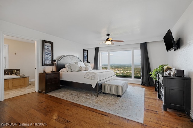 bedroom with hardwood / wood-style floors and ceiling fan