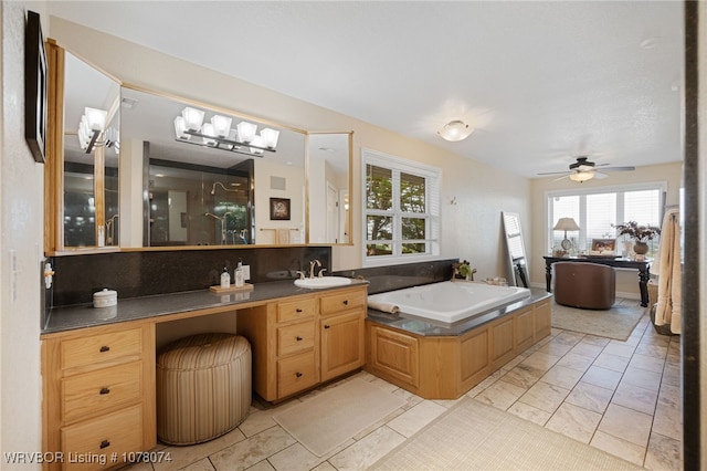 bathroom featuring decorative backsplash, a bath, vanity, and ceiling fan