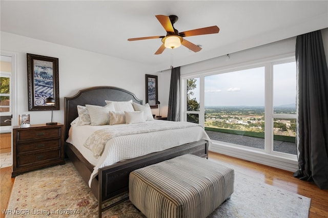 bedroom featuring ceiling fan and light wood-type flooring